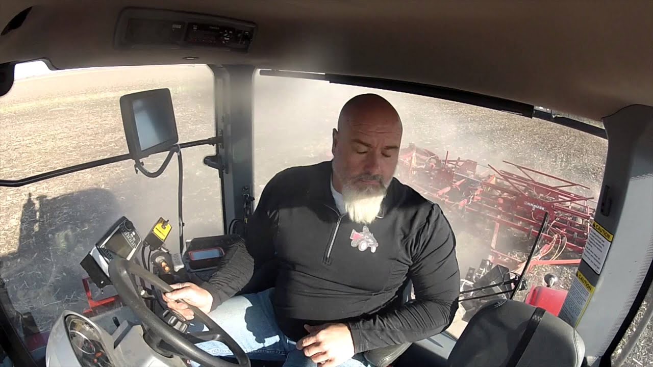 Cab View in a Versatile Delta Track pulling a 50 foot field cultivator