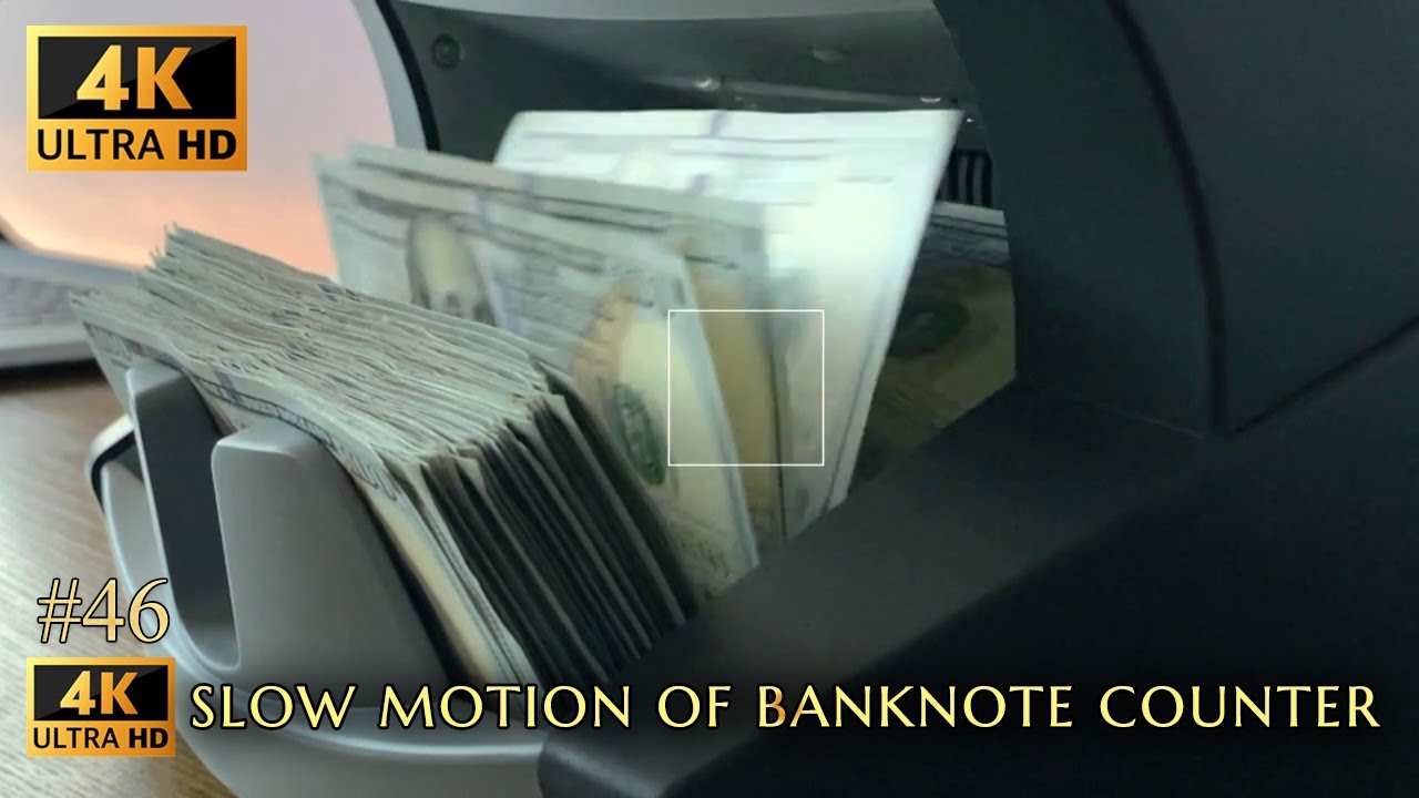 Super slow motion video of Banknote Counter counting 100 dollar bills | Royalty Free Stock clips 4K