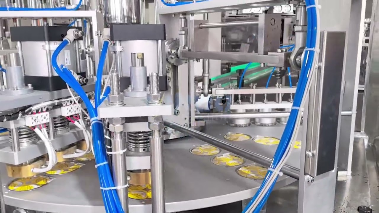 Automatic rotary cup filling and sealing machine