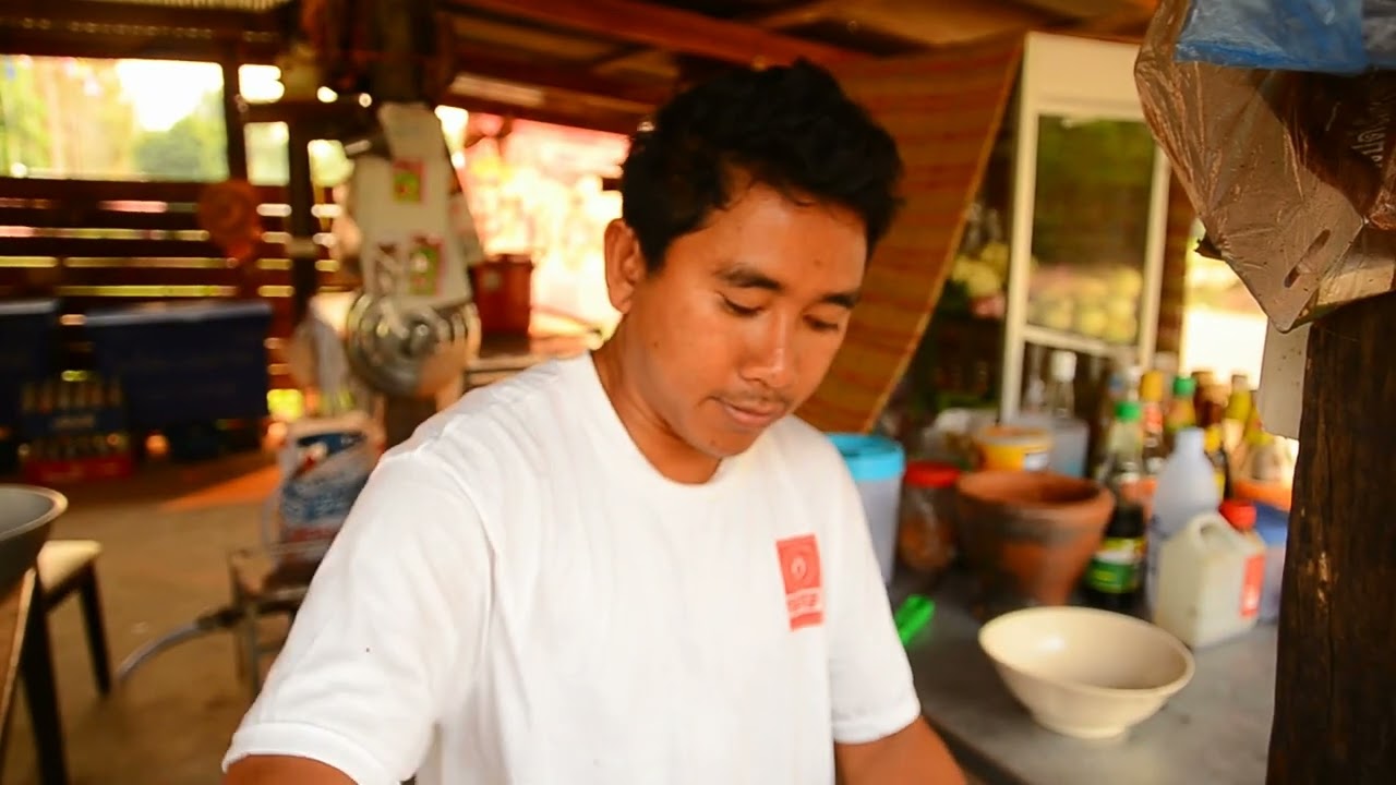 Making green pepper curry dish in rural Thailand.