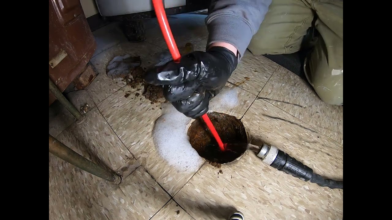 Using a Rigid Flexshaft K9-102 on a sudsy floor drain. 35