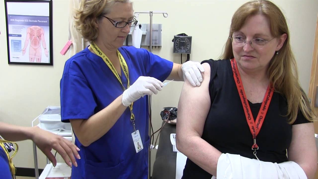 Medical assistant students learn how to give injections at Charter College