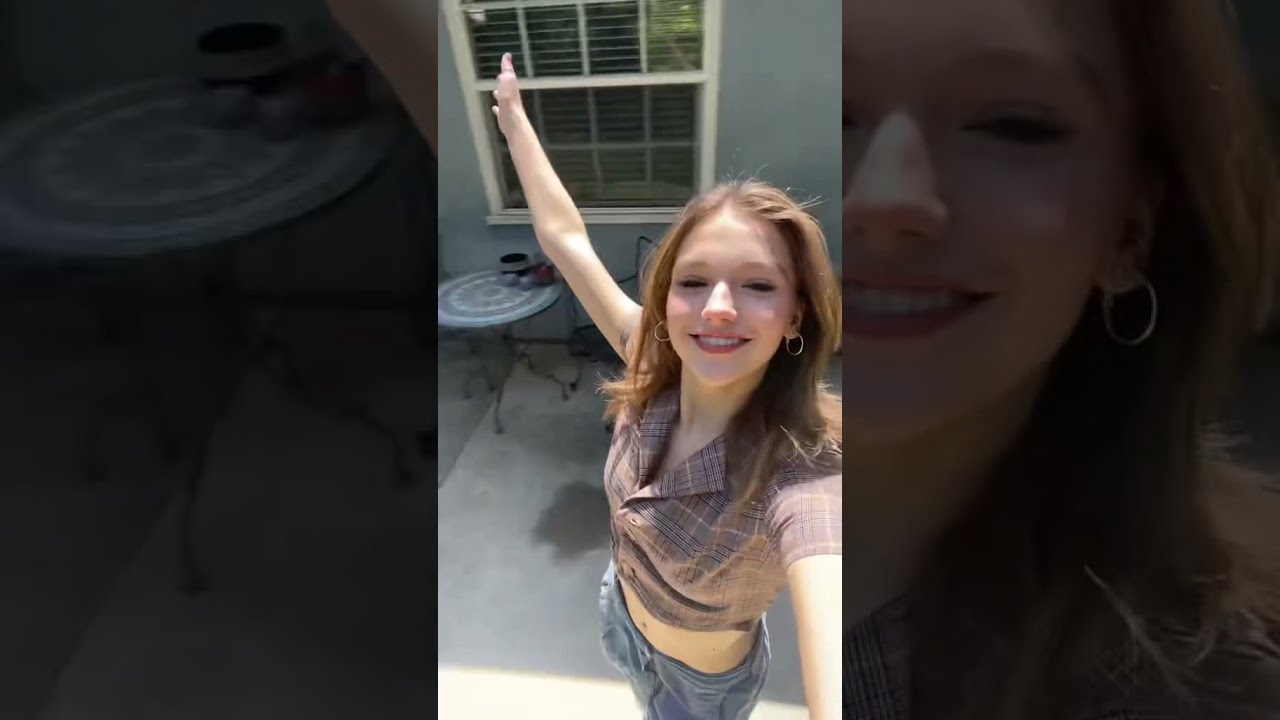 Jayden Bartels showing belly button, in nature.