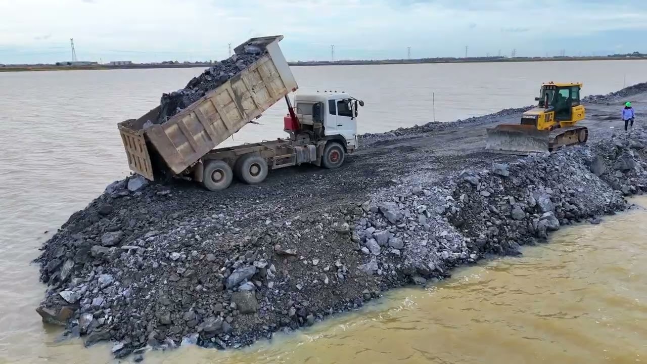 EP03,Fantastic road project Use a truck,wheel loaderand a Dozer Shantui to dump rocks into a sizabl