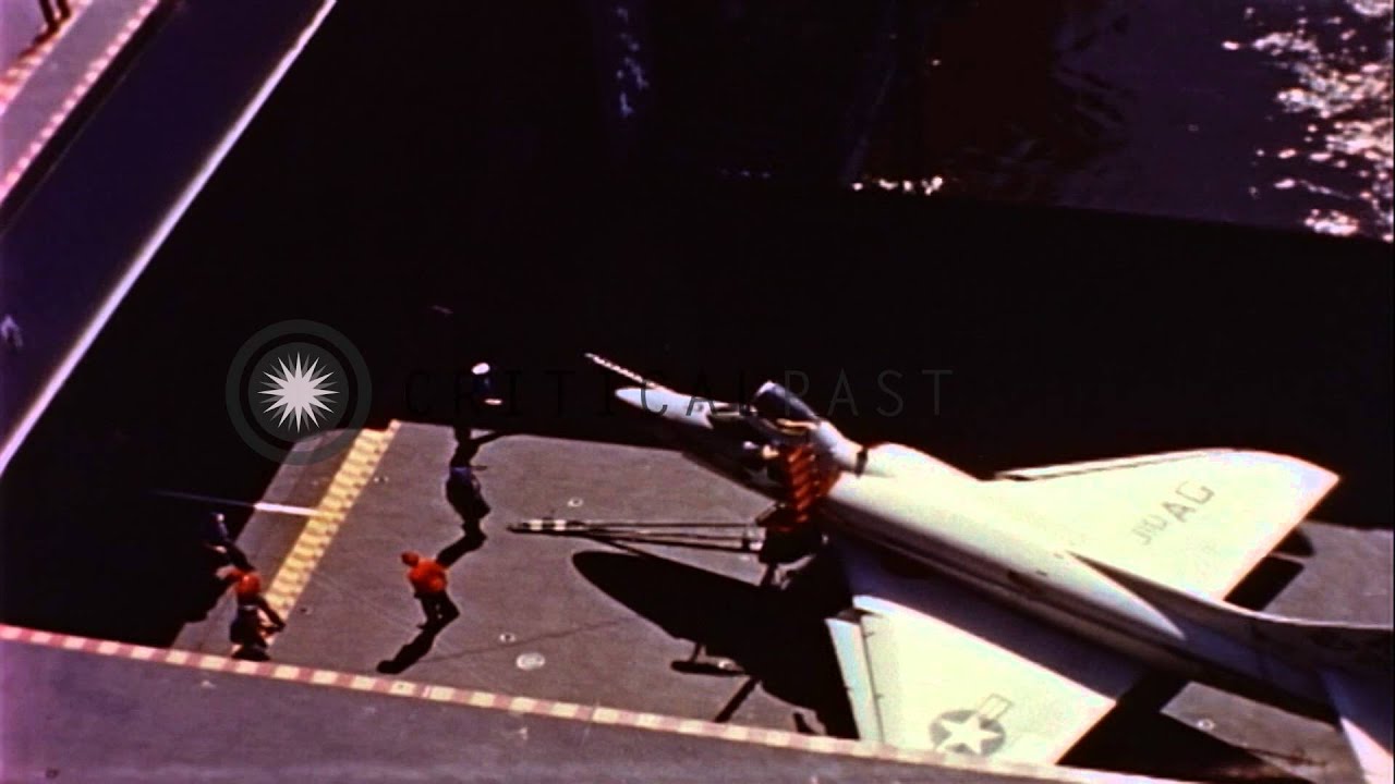 F-11 Tiger and other aircraft landing on USS Forrestal in the Atlantic Ocean, and...HD Stock Footage
