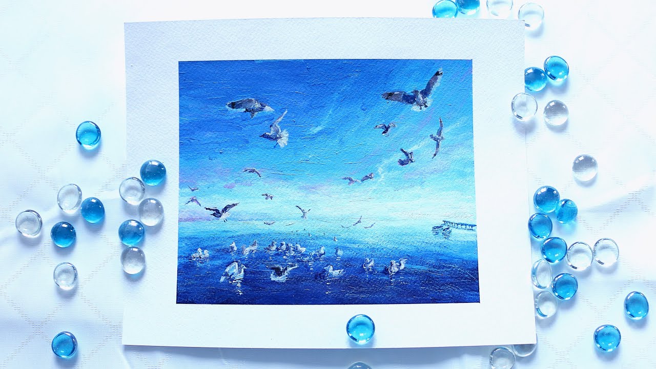 Seagulls flying over the ocean - acrylic painting on paper. Photo study