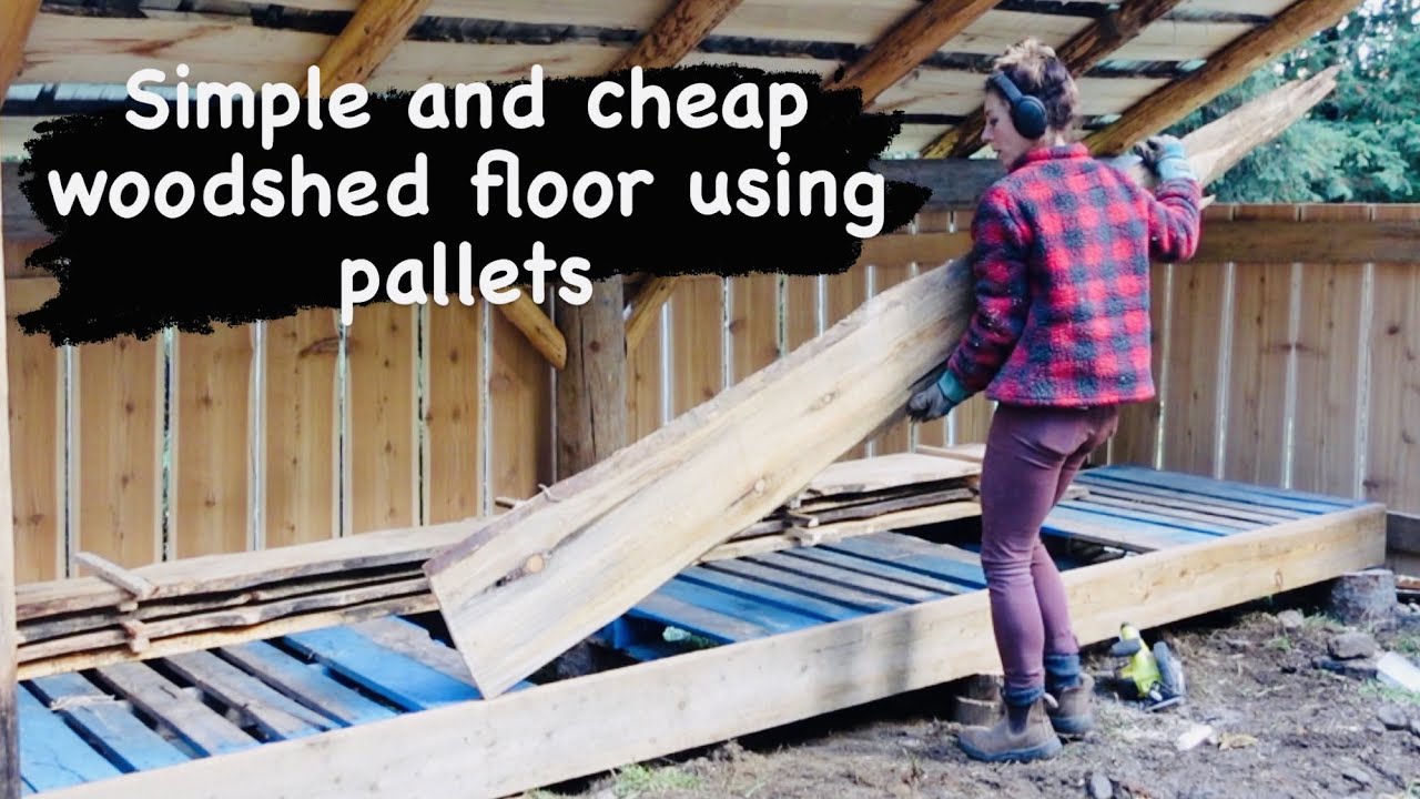 A simple woodshed floor using pallets (and adding facia to the woodshed)
