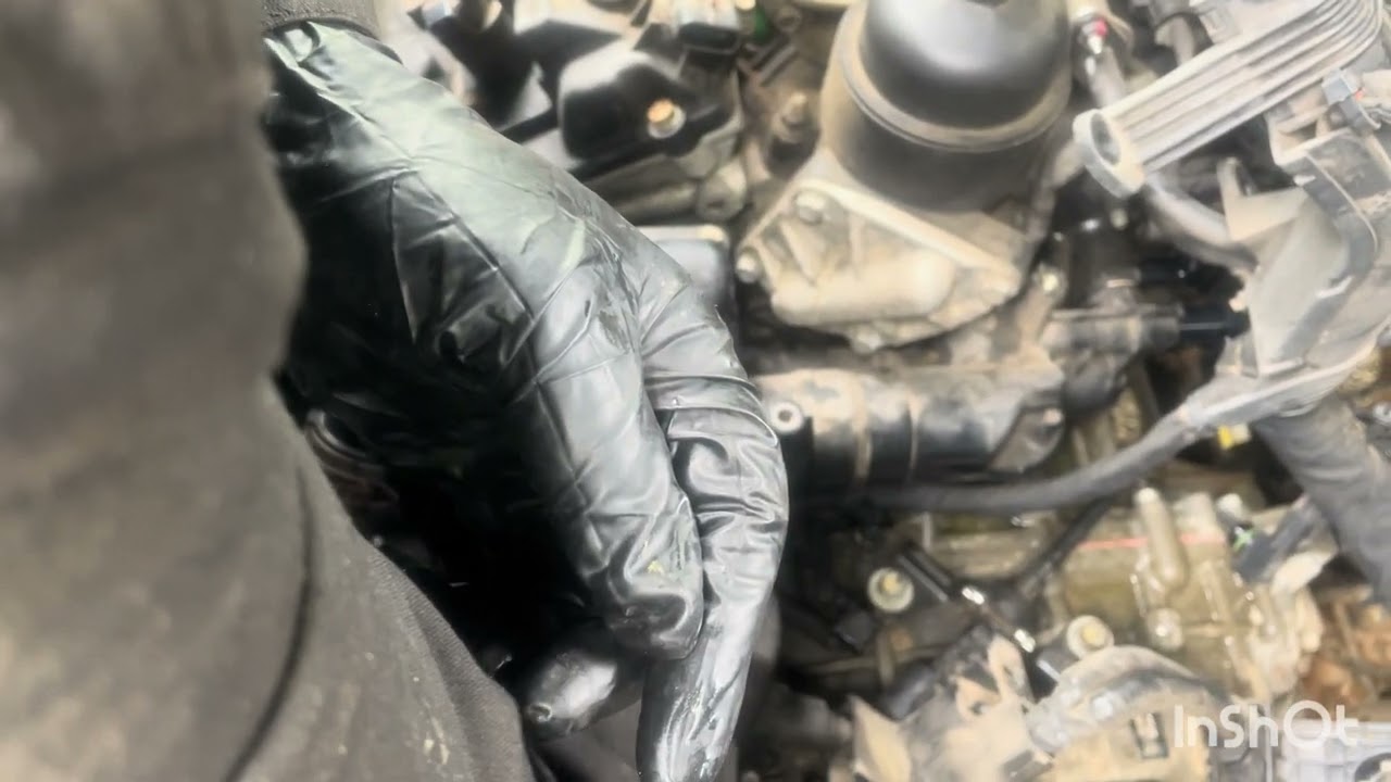Kia Sorento 2012 cambio de thermostat housing tiraba agua