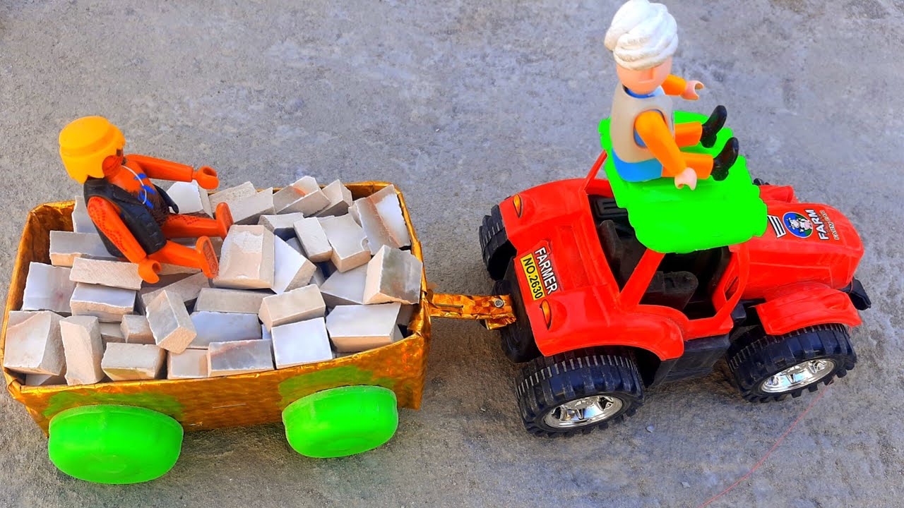 Labourers loading bricks,on tractor trolley/hand made craft,