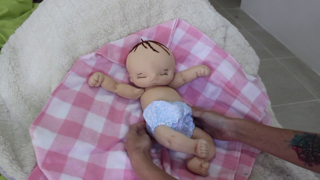 Scarlett, a 15 inch weighted preemie size cloth baby doll