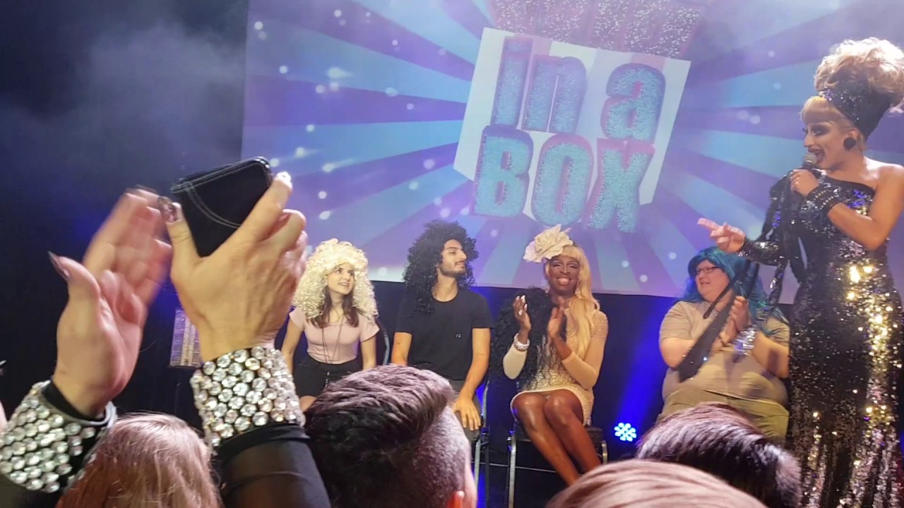Bianca Del Rio  slipping in a cheap wig during Kelly Heelton's performance