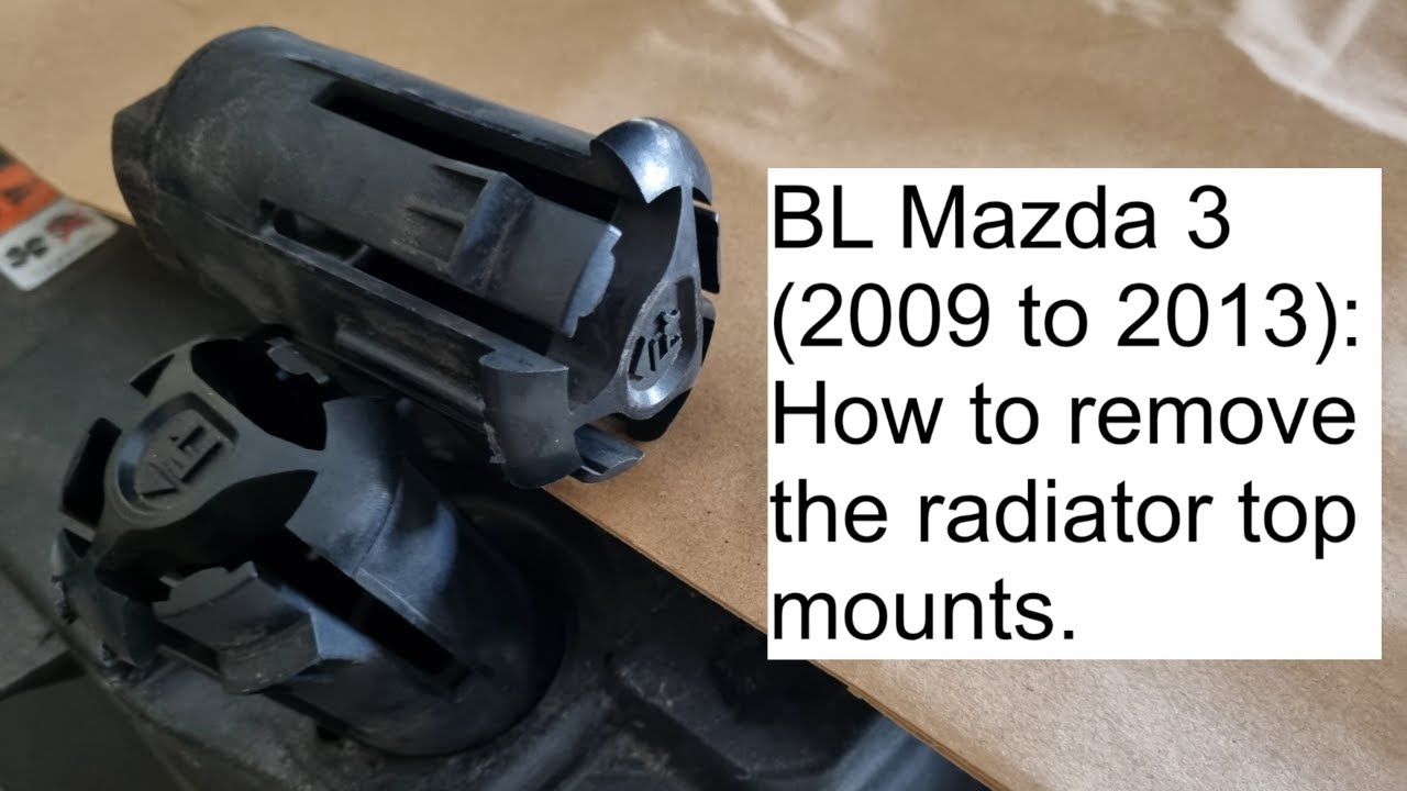 BL Mazda 3: Remove the radiator top mounts. 2009 2010 2011 2012 2013 2nd gen plastic knob lever