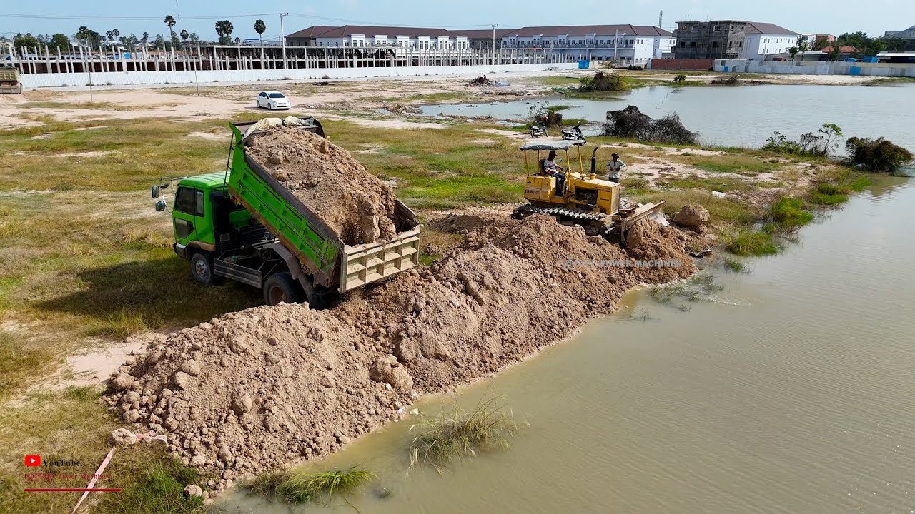 Perfect New Project Expert Operator Komatsu D31P Dozer Pushing Drop Soil In Water  Landfill In Water