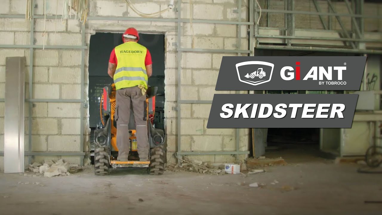 GIANT SKIDSTEER WORKING HARD ON AN INSIDE DEMOLITION