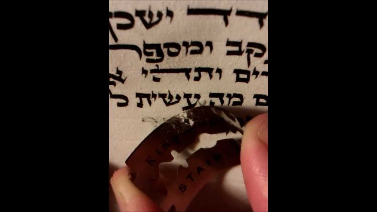 Scribe fixing mistake in Sefer Torah מחיקת טעות בספר תורה