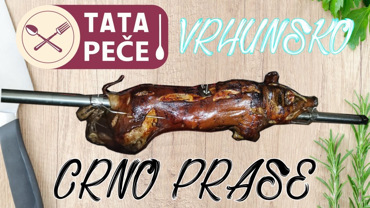 Tata peče crno prase - prase na ražnju