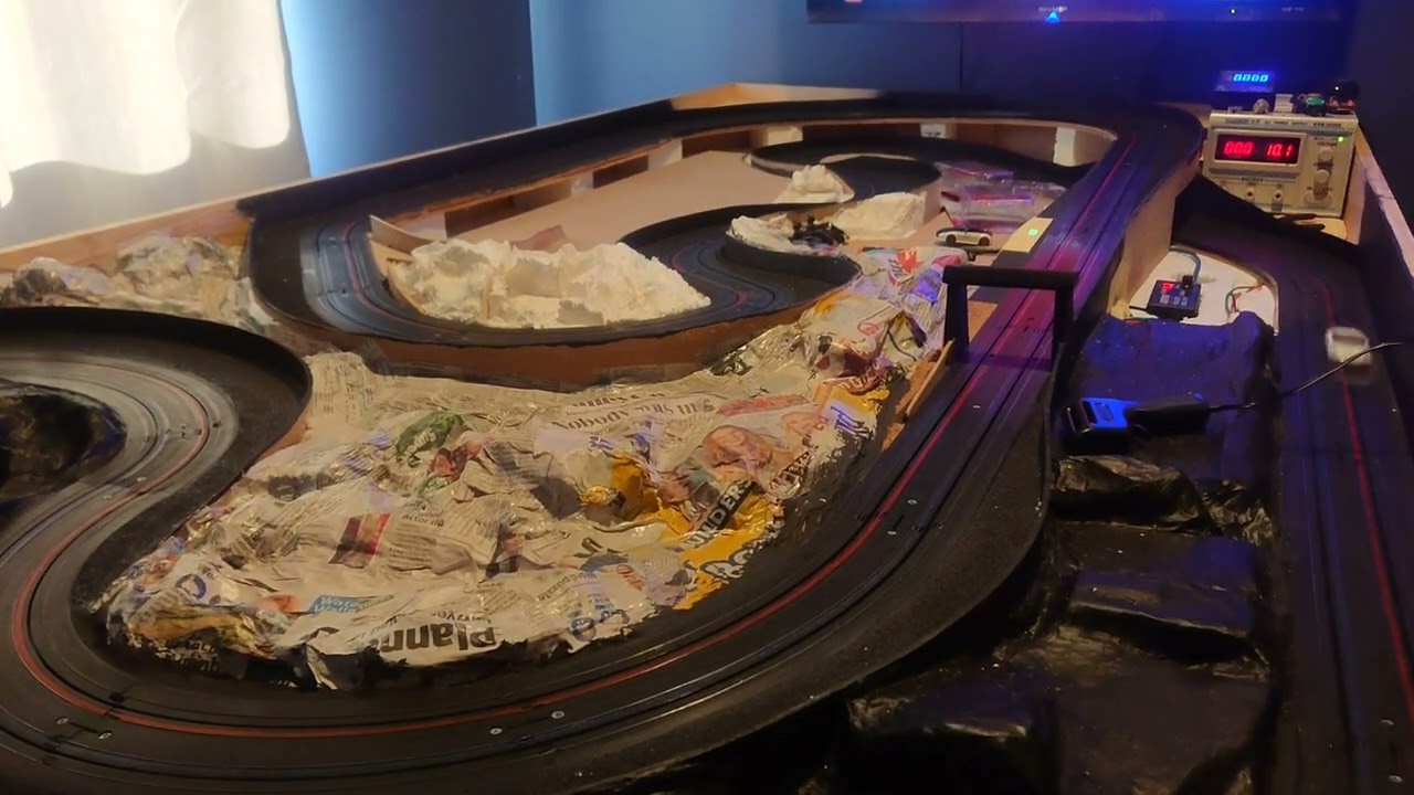 Will they run? Micro Scalextric cars on an AFX track.