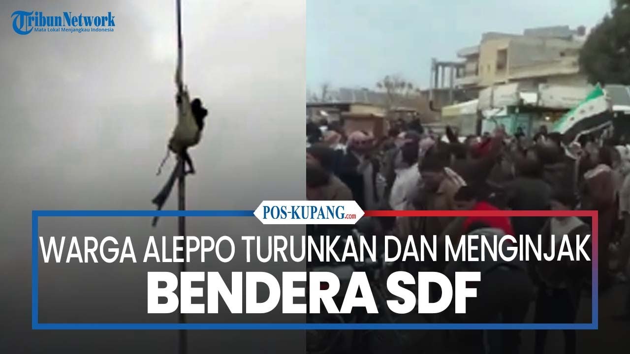 Warga Aleppo Turunkan dan Menginjak Bendera SDF