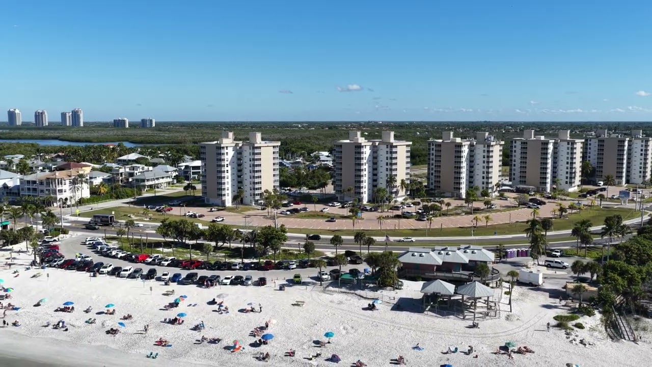 Naples Drone aviates over Barefoot Beach and Doc's Beach House at the bend on Hickory Blvd Beach