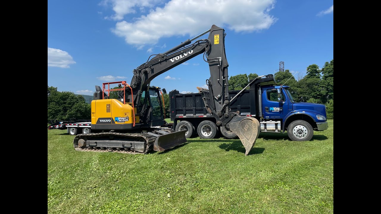 Volvo ECR145EL Excavator, Dump Truck, and Eager Beaver Trailer