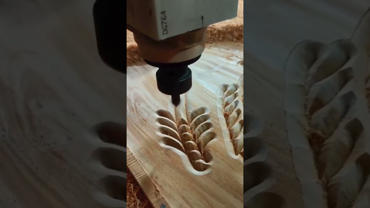 CNC carving machine detailed pattern on wooden surface 