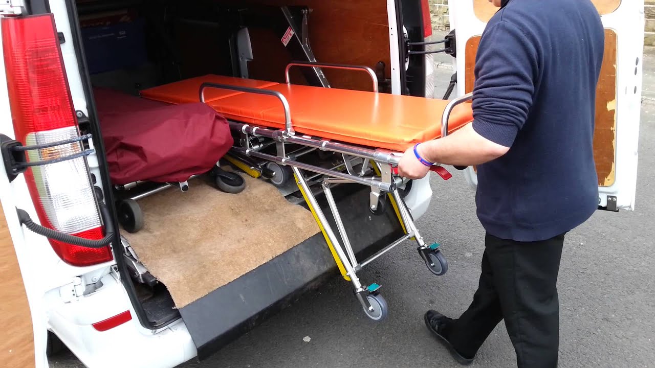 Private Ambulance / hearse  stretcher / trolley -- one man loading operation