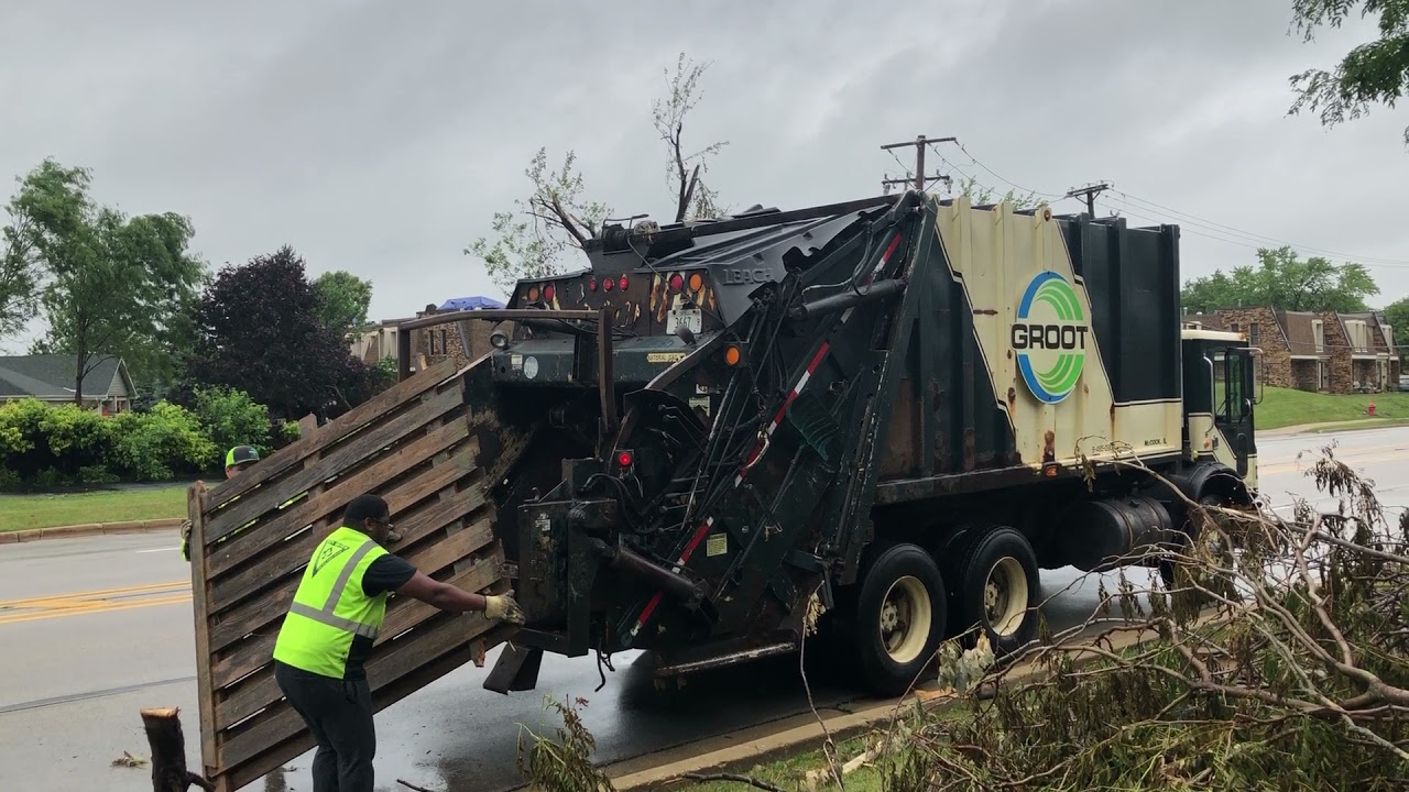 Tornado Bulk Cleanup- Groot Mack MR Leach Rear Loader Garbage Truck Packing a Fence