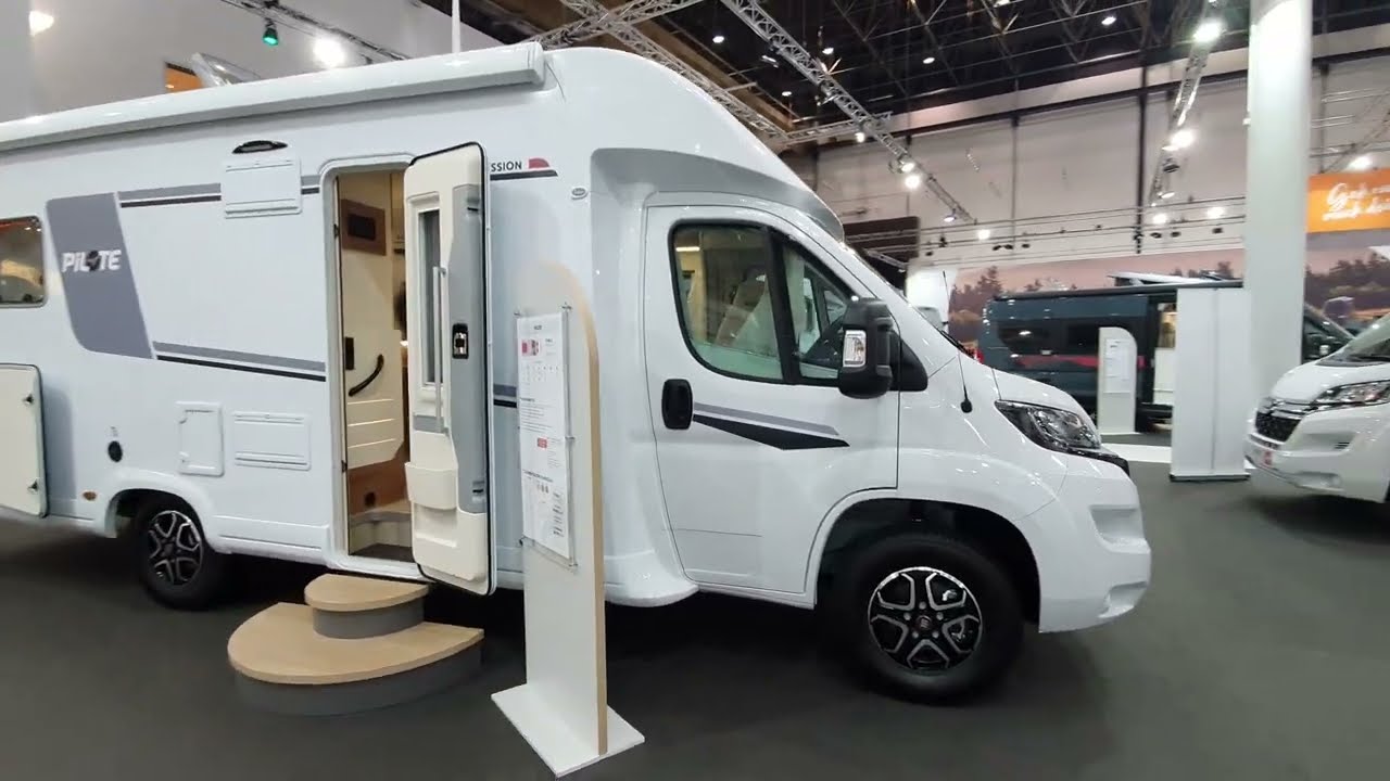 Rear queen bed. Pilote 746C motorhome tour.