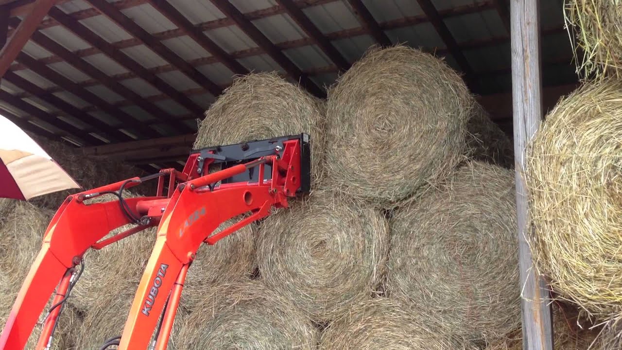 Stacking 4' Round Bales 4 high