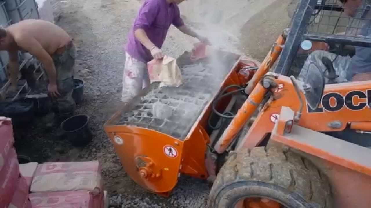 Concrete mixer Kovaco ML 300 on a Locust L 903 skid steer loader