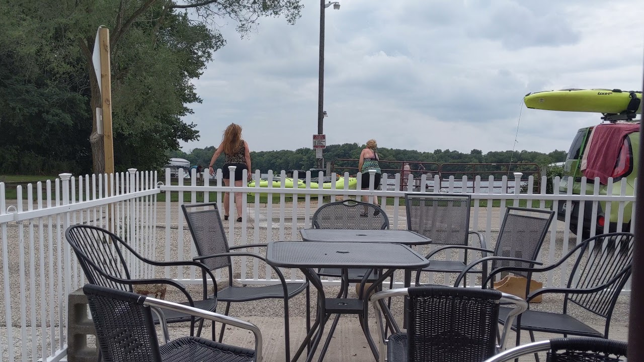 Women carrying a kayak across the street