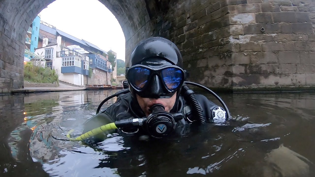 Underwater archeologist shows off small finds from River Wear.