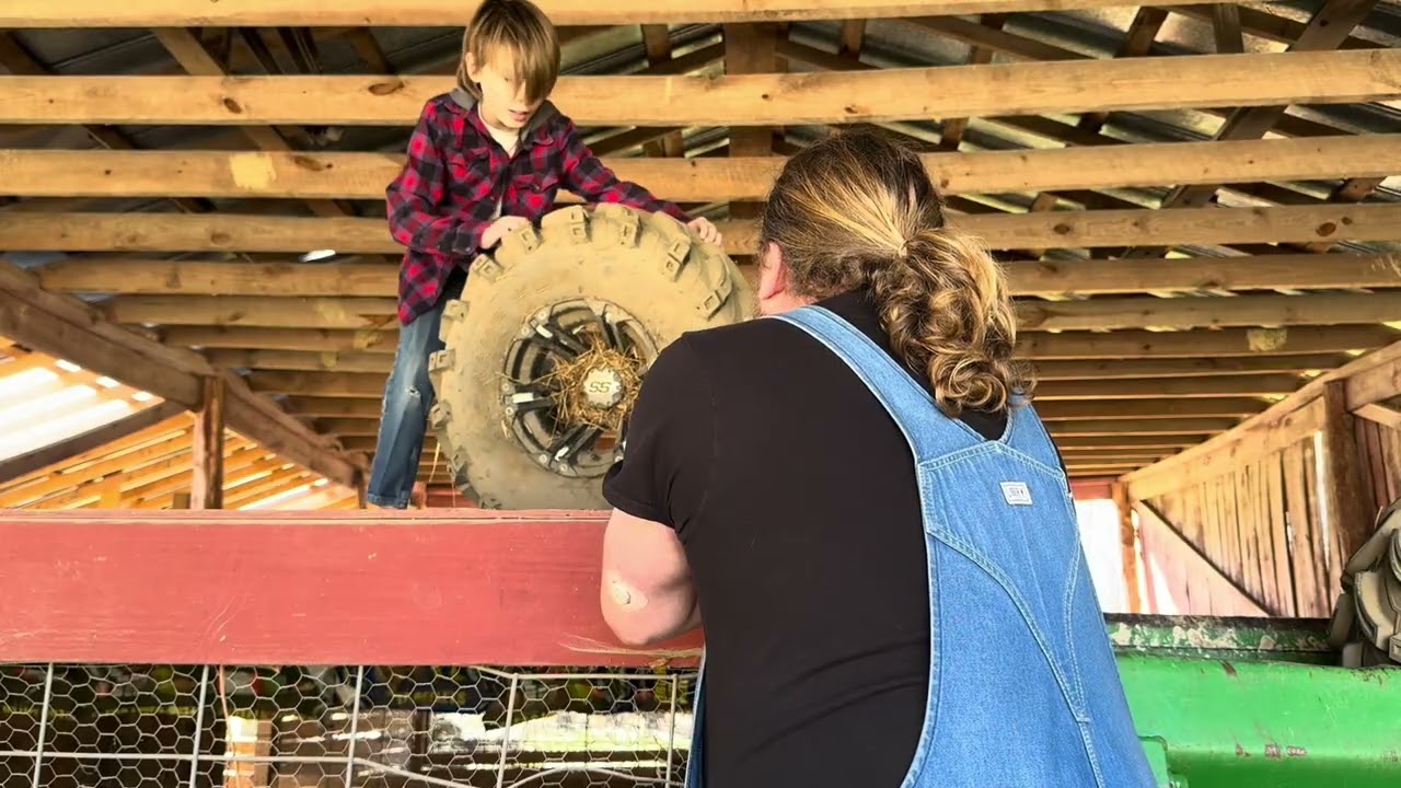 Putting some different wheels on the ATV. 