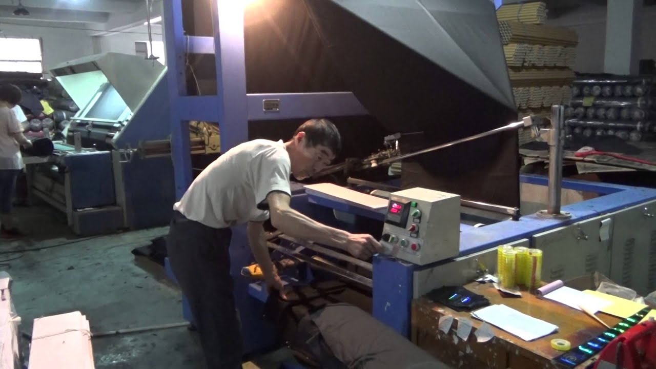 How to make double folded packing for suit fabric in china factory