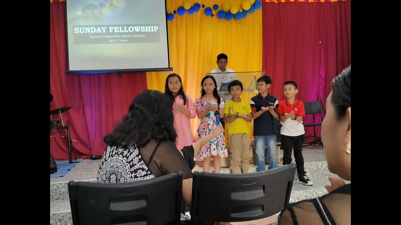 Melbie with Kids at the Church