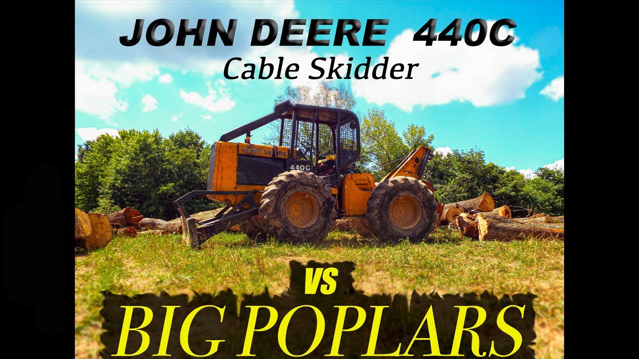 John Deere 440C cable skidder vs. Big Poplar trees.