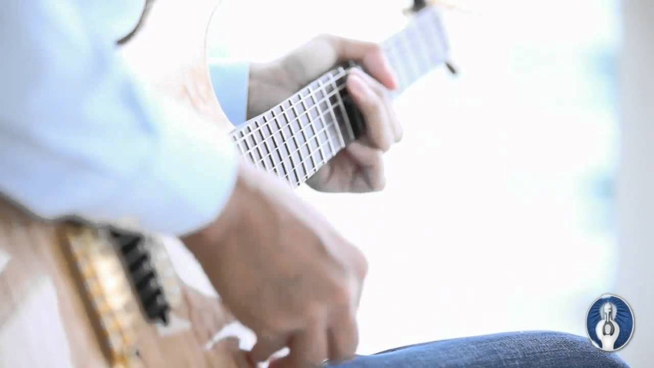 Eben Pagan plays guitar