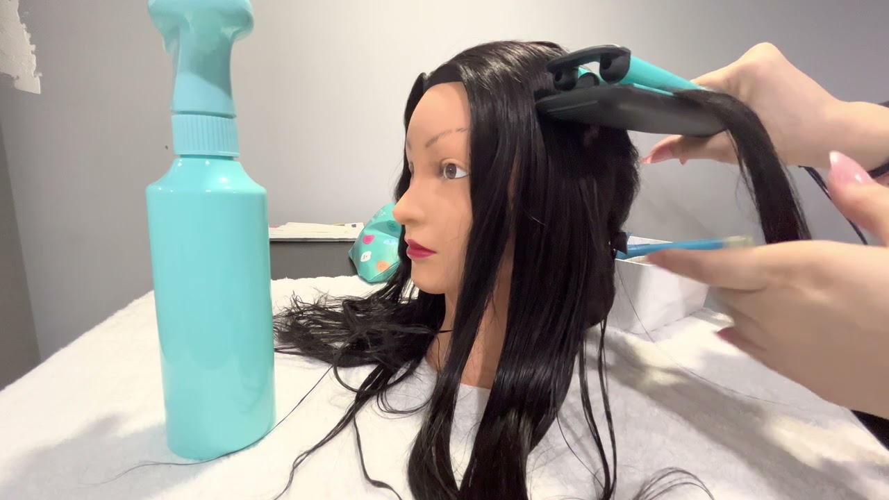 ASMR makeup and hair styling on mannequin head . Hair brushing and rummaging sounds .