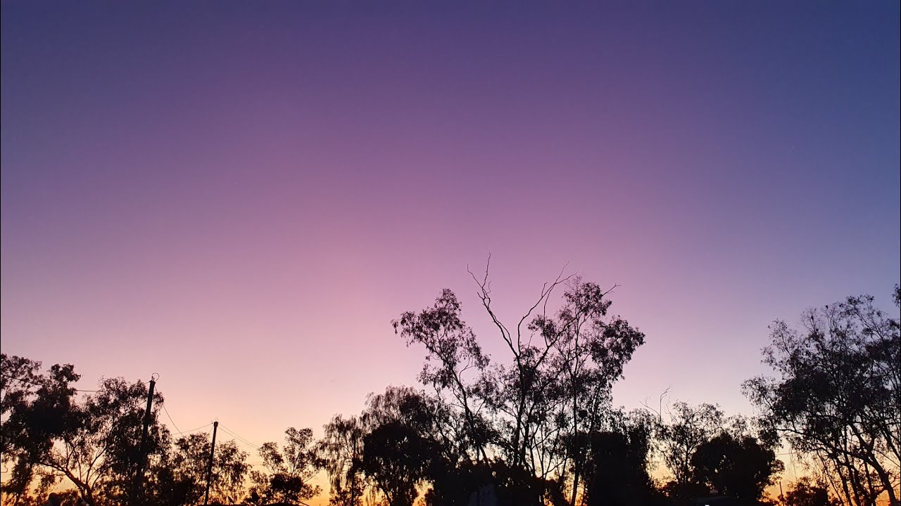 Stuart Highway and the purple sunset in Ti Tree