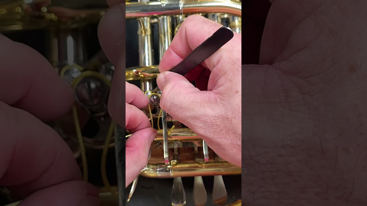 How to tie a French horn rotor string. #instrumentrepair #instrumentrepairschool #frenchhorn 