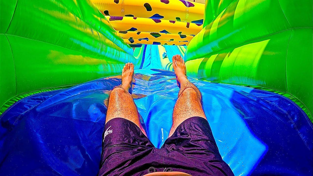 Racing Down the Giant Inflatable Slide at Wave Island Waterpark