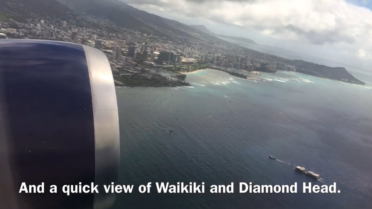 Taking Off From Honolulu Airport, Hawaii, flying by Waikiki