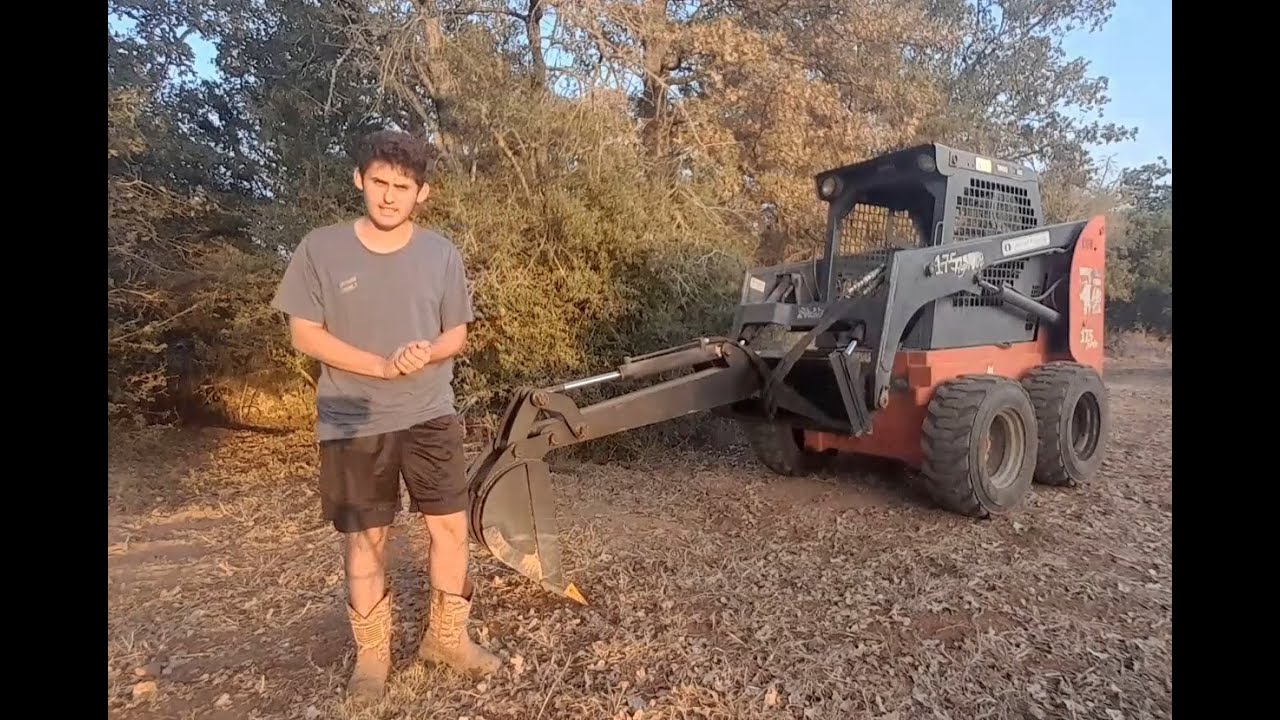 Skid steer backhoe demo