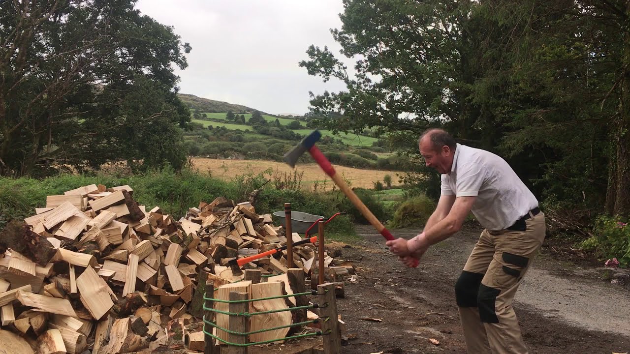 Splitting firewood: knotty difficult rounds with twisted grain.