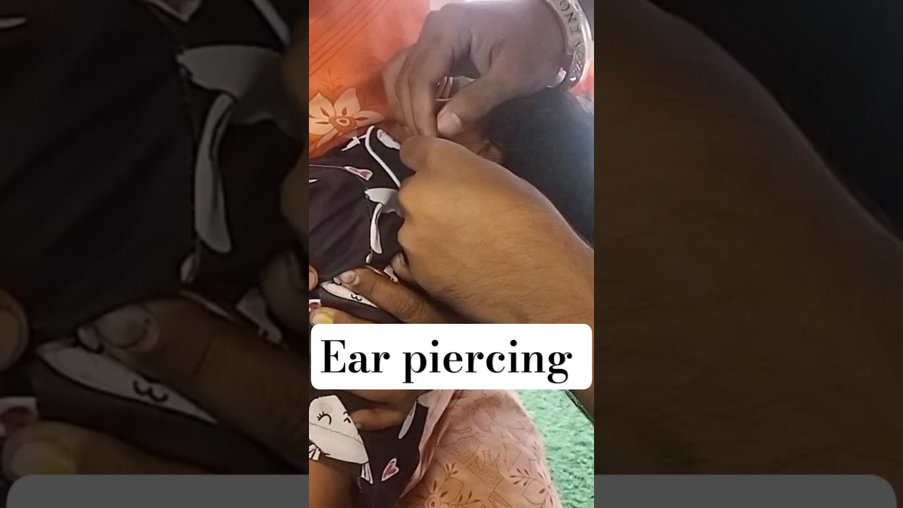 1 year old girl ear piercing by hand 👏