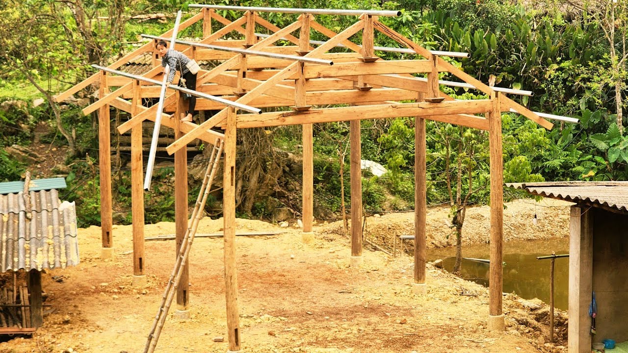 The house design uses sturdy wooden beams and iron rafters.