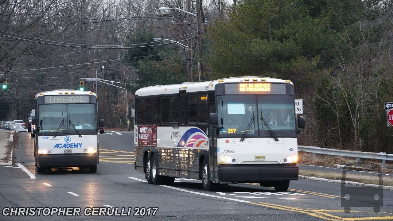 NJ TRANSIT AND ACADEMY BUS ACTION AT UNION HILL PARK AND RIDE IN MARLBORO NEW JERSEY