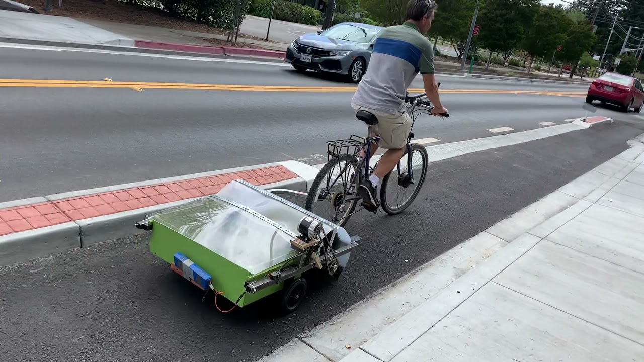 Bike lane sweeper with hopper