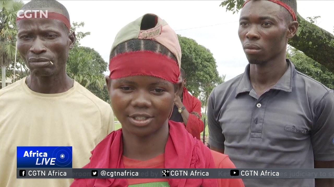 Child soldiers surrender arms and amulets in Kananga region.