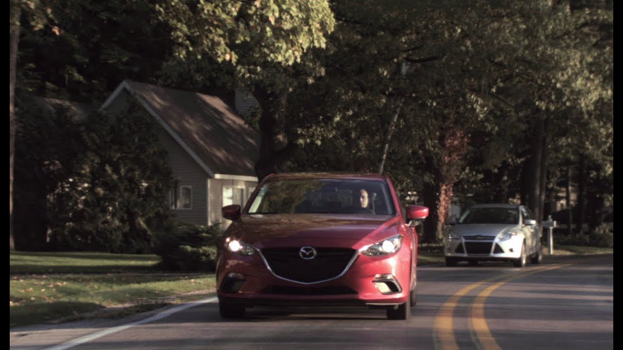 2014 Mazda 3 i Grand Touring vs. 2014 Ford Focus SE - CAR and DRIVER